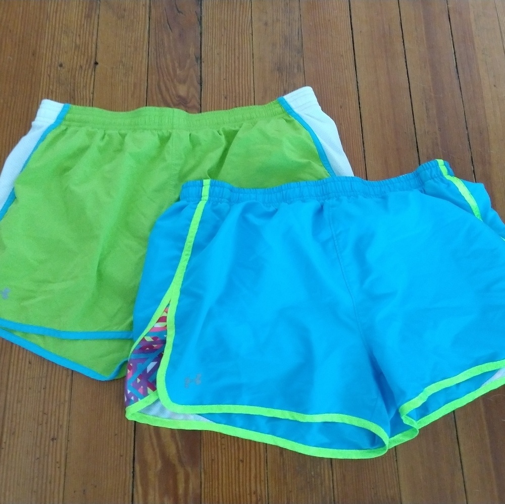 Two pairs of Under Armor running shorts